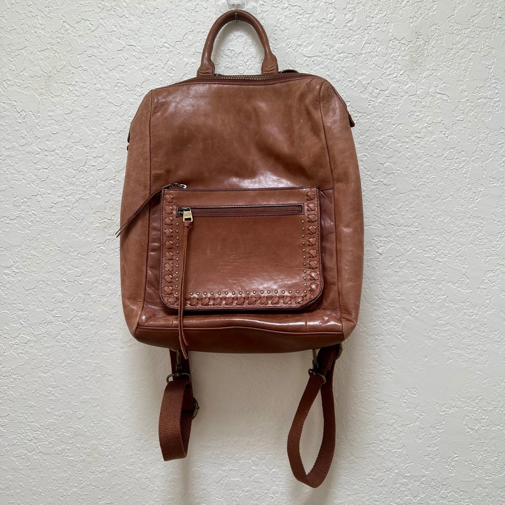 The Sak Brown Leather Whipstitch Convertible Backpack with Bohemian Guitar Strap